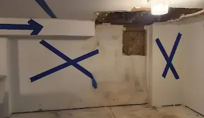 Wet ceiling drywall opened up and marked with tape for cutting out